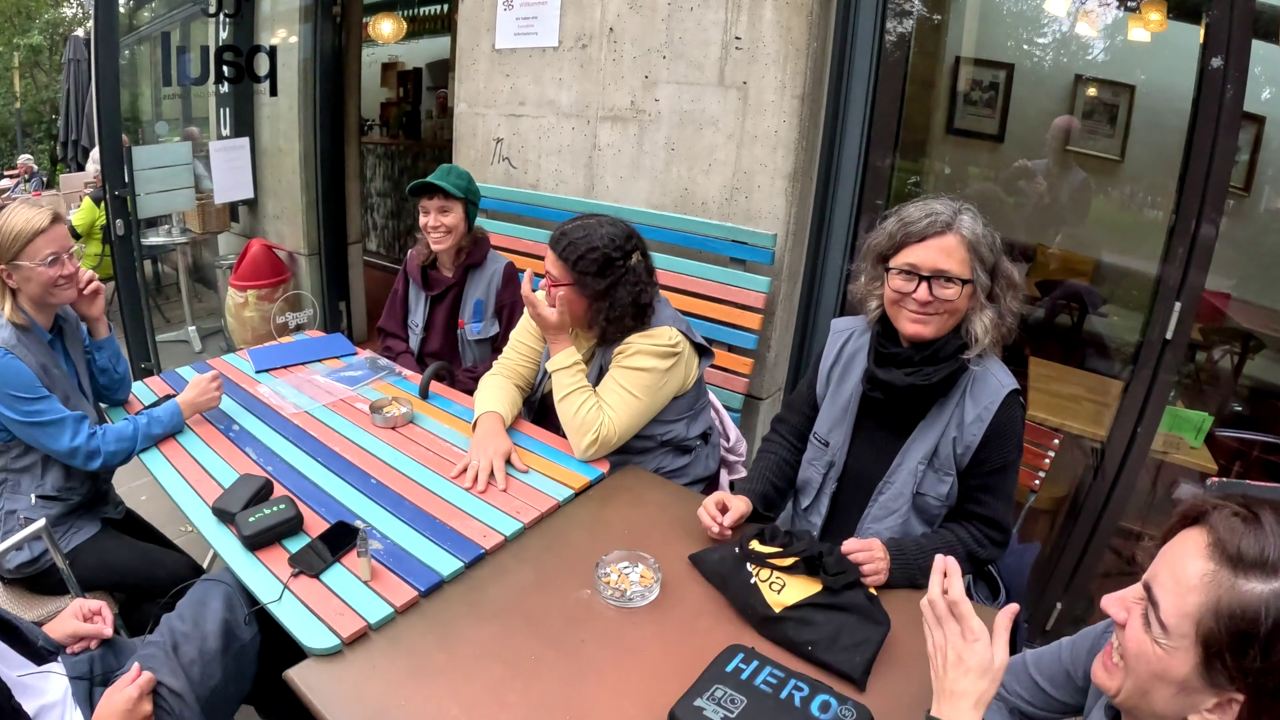 the simularr team sits outside around a table