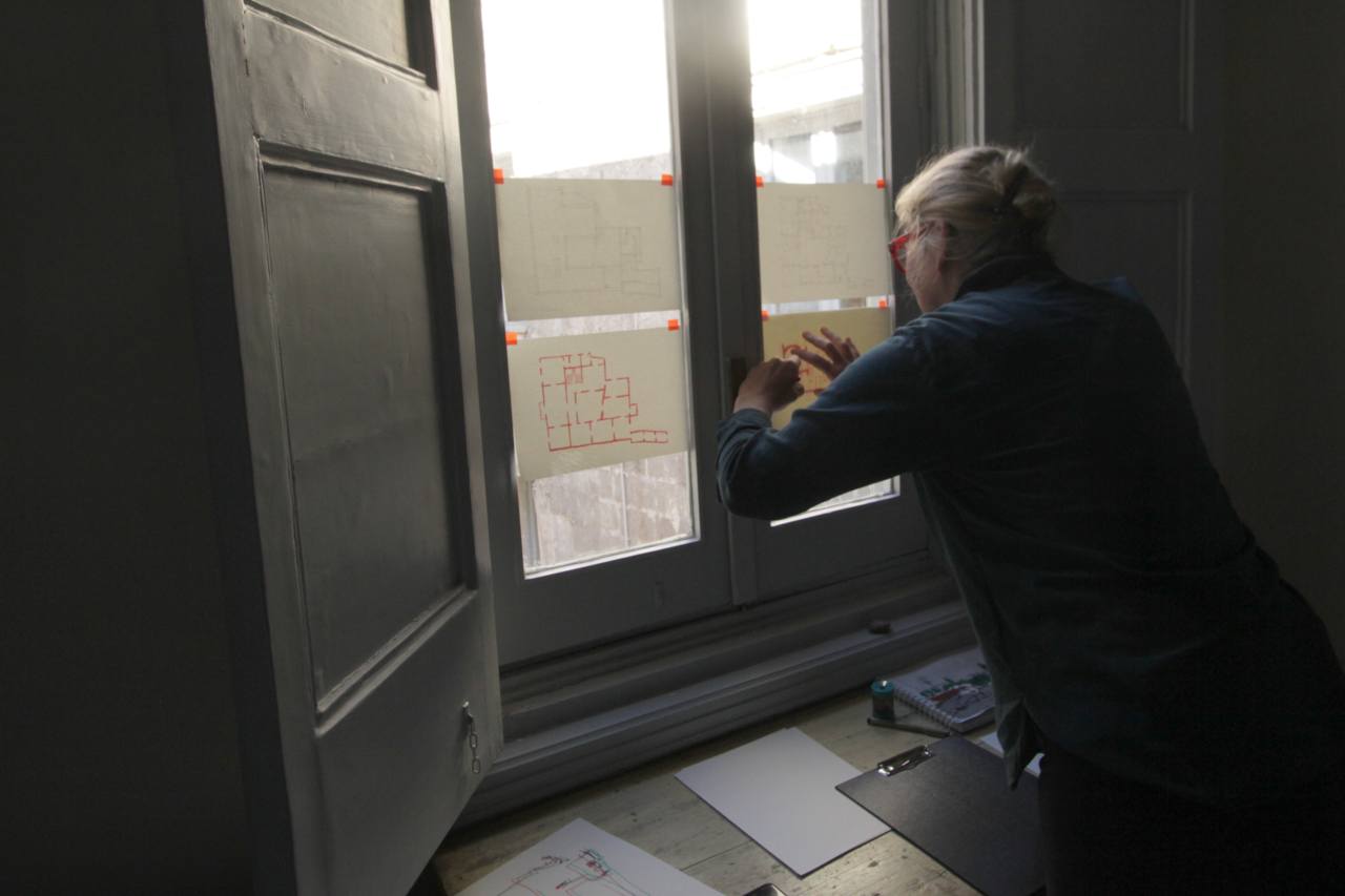 window pane at the Palazzo Russo in San Cesario with floor plan drawing attached