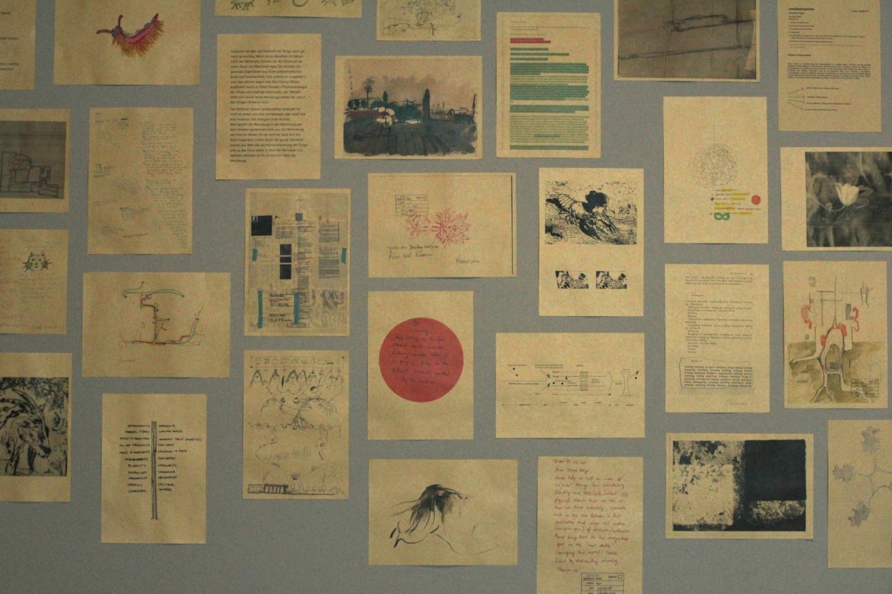 a wall of paper notations